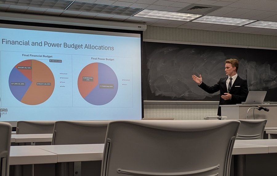 Josiah presenting the financial and power budget allocation slide